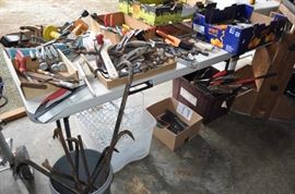 And now the garage... the garage EVERY guy wants to own... nearly 800sf and pretty close to two stories tall!   5ft stainless junction box, air tools, animated 5ft santa, Aquaflow pump, building supplies, camping supplies, Christmas and holiday items, cleaning supplies, commercial painting equipment and supplies, contractor’s equipment, Craftsman tool boxes, extensions cords, fishing collectibles antique and vintage, fishing equipment new and old, fishing rods and reels, garden art TONS, garden fertilizers and more, gardening supplies and tools hundreds, Imperial 6 burner stove/oven, ladders, Livingston 2 person fiberglass boat, loading ramps, Lorex cookware fan, Minnkota trolling motor, outdoor pots, paint sprayers, pet supplies, picnic table, plants, plastic bins all sizes, plumbing supplies, refrigerator, secretary with glass doors above drop front with drawers, front with drawers, Zero gravity outdoor chair… and the regular stuff – saws, hammers, wrenches, plumbing stuff, screwdriv