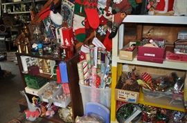 And now the garage... the garage EVERY guy wants to own... nearly 800sf and pretty close to two stories tall!   5ft stainless junction box, air tools, animated 5ft santa, Aquaflow pump, building supplies, camping supplies, Christmas and holiday items, cleaning supplies, commercial painting equipment and supplies, contractor’s equipment, Craftsman tool boxes, extensions cords, fishing collectibles antique and vintage, fishing equipment new and old, fishing rods and reels, garden art TONS, garden fertilizers and more, gardening supplies and tools hundreds, Imperial 6 burner stove/oven, ladders, Livingston 2 person fiberglass boat, loading ramps, Lorex cookware fan, Minnkota trolling motor, outdoor pots, paint sprayers, pet supplies, picnic table, plants, plastic bins all sizes, plumbing supplies, refrigerator, secretary with glass doors above drop front with drawers, front with drawers, Zero gravity outdoor chair… and the regular stuff – saws, hammers, wrenches, plumbing stuff, screwdriv