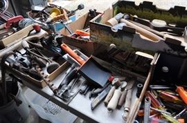 And now the garage... the garage EVERY guy wants to own... nearly 800sf and pretty close to two stories tall!   5ft stainless junction box, air tools, animated 5ft santa, Aquaflow pump, building supplies, camping supplies, Christmas and holiday items, cleaning supplies, commercial painting equipment and supplies, contractor’s equipment, Craftsman tool boxes, extensions cords, fishing collectibles antique and vintage, fishing equipment new and old, fishing rods and reels, garden art TONS, garden fertilizers and more, gardening supplies and tools hundreds, Imperial 6 burner stove/oven, ladders, Livingston 2 person fiberglass boat, loading ramps, Lorex cookware fan, Minnkota trolling motor, outdoor pots, paint sprayers, pet supplies, picnic table, plants, plastic bins all sizes, plumbing supplies, refrigerator, secretary with glass doors above drop front with drawers, front with drawers, Zero gravity outdoor chair… and the regular stuff – saws, hammers, wrenches, plumbing stuff, screwdriv