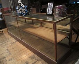 Antique 10 ft showcase from Samuelson's Confectionery, when  located at Seven Corners in Mpls.  Comes with  a framed 8x10 B&W Photo of the showcase in Samuelson's circa 1930's.