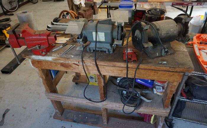 Workbench with grinders and a vise