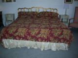 King size bed with gilded headboard