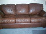 Brown leather sofa sleeper