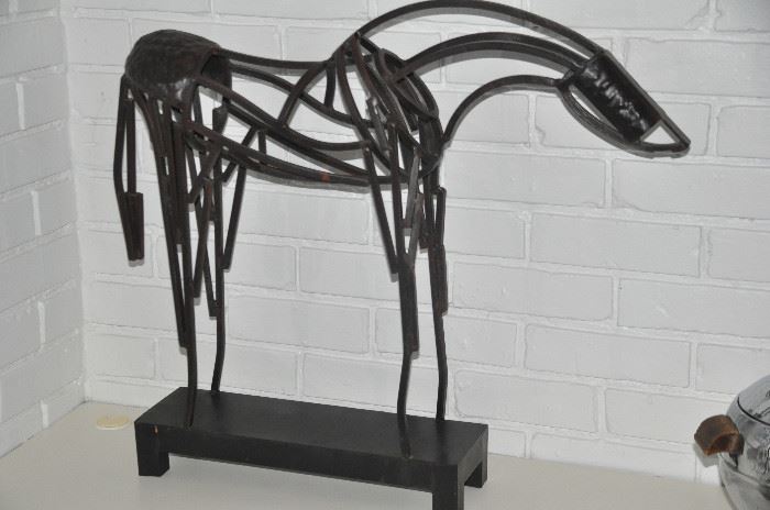 One of the two metal horse sculptures available, 27"w x 24"h