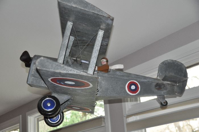 Large tin Fighter Airplane with pilot