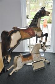 Authentic Armitage-Herschell fully restored and mounted Carousel Jumping Horse, c. 1900 (50"w x56"h x 22"d) shown with a fantastic wooden carved hobby horse. 