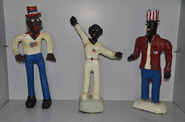Paper mache people on stands, all with American flag symbols
