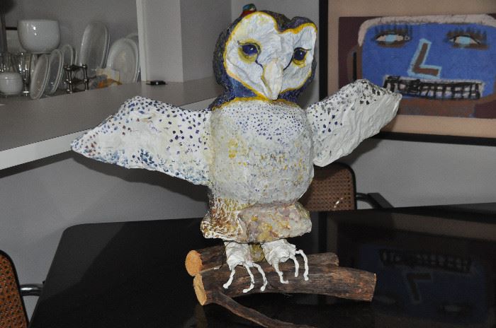 Large paper mache painted owl mounted on logs,       24"h x 32"w