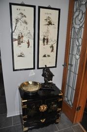 Wonderful petite black lacquer painted Asian chest with 3 interior drawers and etched brass trim. Shown with a pair of stone inlay painted Asian panels. 