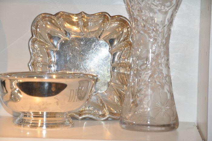 Silver-plate serving pieces and vintage cut glass. 