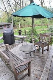 Outdoor seating area complete with teak bench, teak chair by Kingsley-Bate genuine teak furniture VA and stone table