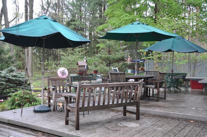 Gorgeous deck filled with patio sets, planters and garden decor! 