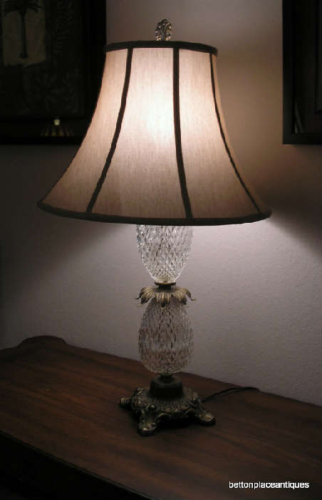 One of a matching pair of glass and brass pineapple lamps