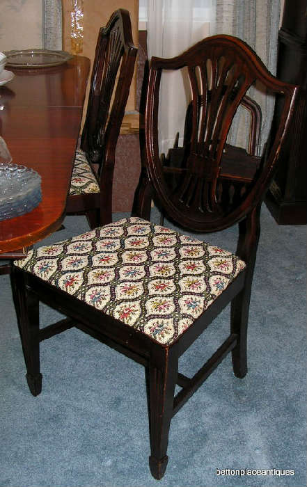 Six Mahogany Shield Back Chairs, One of which is a Captain...