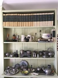 Pewter collection with many different types of pieces.