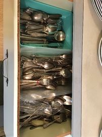 Silverplate dining utensils.