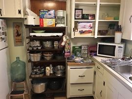 Microwave, coffee maker & cookware.