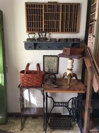 Sewing machine base, printer's tray & sad irons.