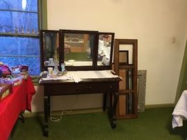 2-drawer vanity with hidden jewelry storage behind center mirror.