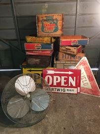 Some Awesome wood crates, signs and industrial wall mount fan.