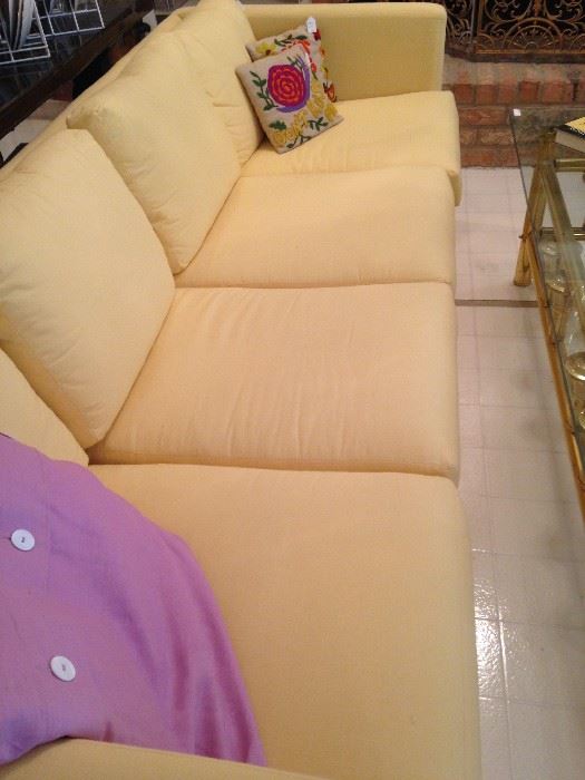 1 of 2  sleek 4-cushion yellow sofas 
