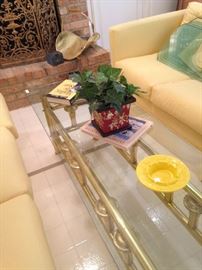 Narrow and long brass and glass top coffee table
