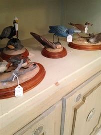 More bird figurines with wooden bases