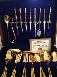 Community gold toned stainless flatware set