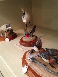 Bird figurines with wooden bases