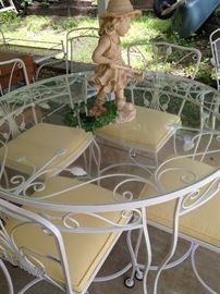 White round patio table with 4 chairs/yellow cushions