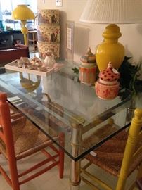One of two glass top dining tables