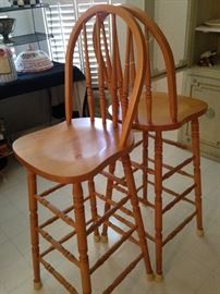 Two light wood bar stools