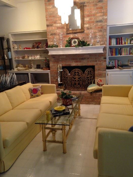 Long, sleek 4-cushion yellow sofas give a great pop of color!