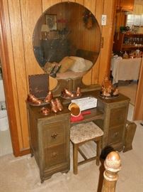 Antique dresser with attached oval mirror