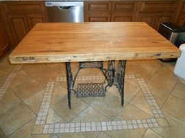 butcher block table on singer sewing base