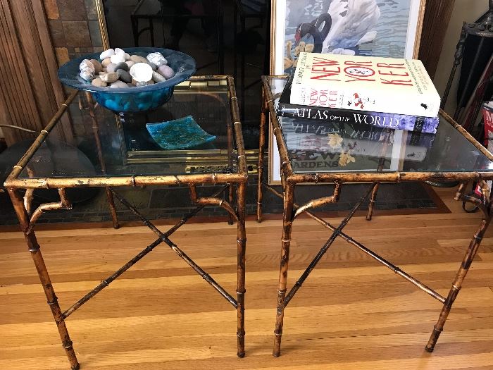 Pair of glass top accent tables with ornate metal base