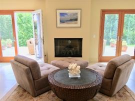 Sectional components: 2 chairs and ottoman;  Drum table from the Kreiss Collection