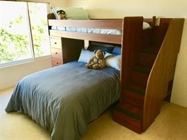 Twin over double bunk bed with drawer and bookcase storage by  Berg Furniture Co.;