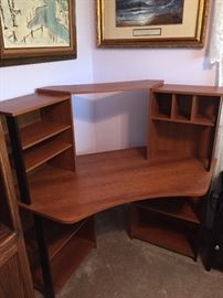Corner desk with plenty of shelves and room for computer equipment