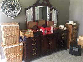 Dresser, wicker hampers and assorted western hats