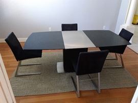 Milano dining table with leaf insert.
