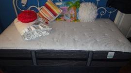 twin bed w/ white wrought iron head and footboard