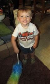 My grandson all smiles and loving helping get things ready!