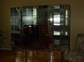 Mirrored 3-piece wall unit..center is entertainment center, end pieces separate and can be corner curios or together as one