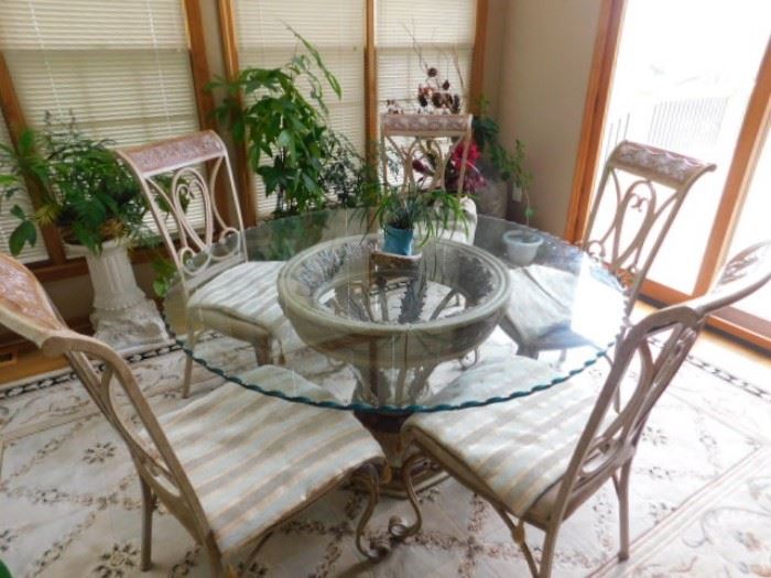 Nebraska Furniture Mart  round glass table and Chairs 