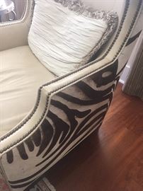pair of leather and zebra hide chairs 