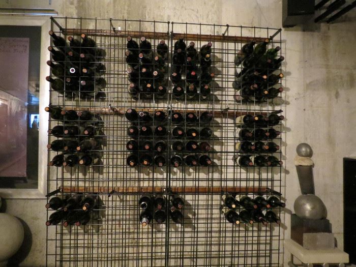 Lot#  120                                                                                                                      1 large wire wine racks ( each holding over 300 bottles)     $ 75.00         wine rack only               