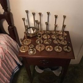 Brass candlesticks on vintage one drawer night stand.