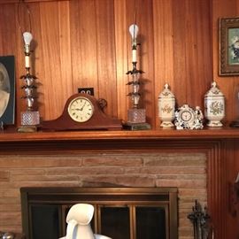 Mantle clock, pair of lamps, and pair of lidded jars with clock.