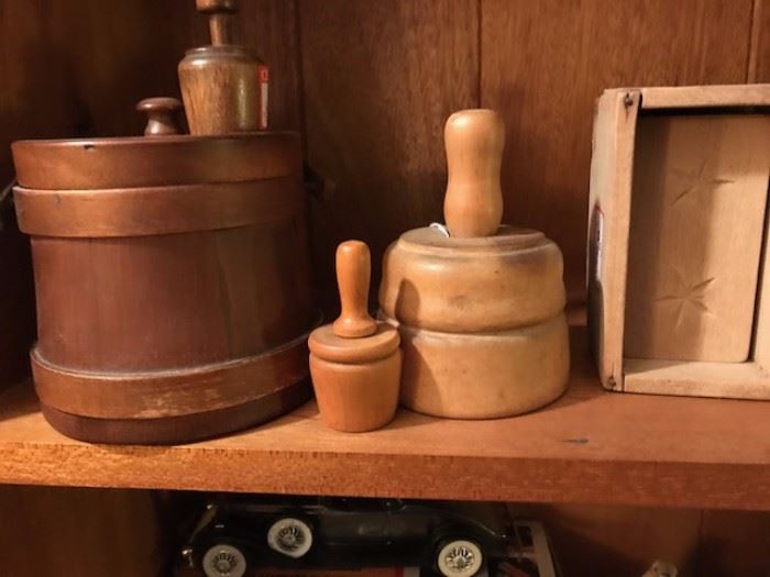 Antique butter molds with a miniature wooden syrup bucket.